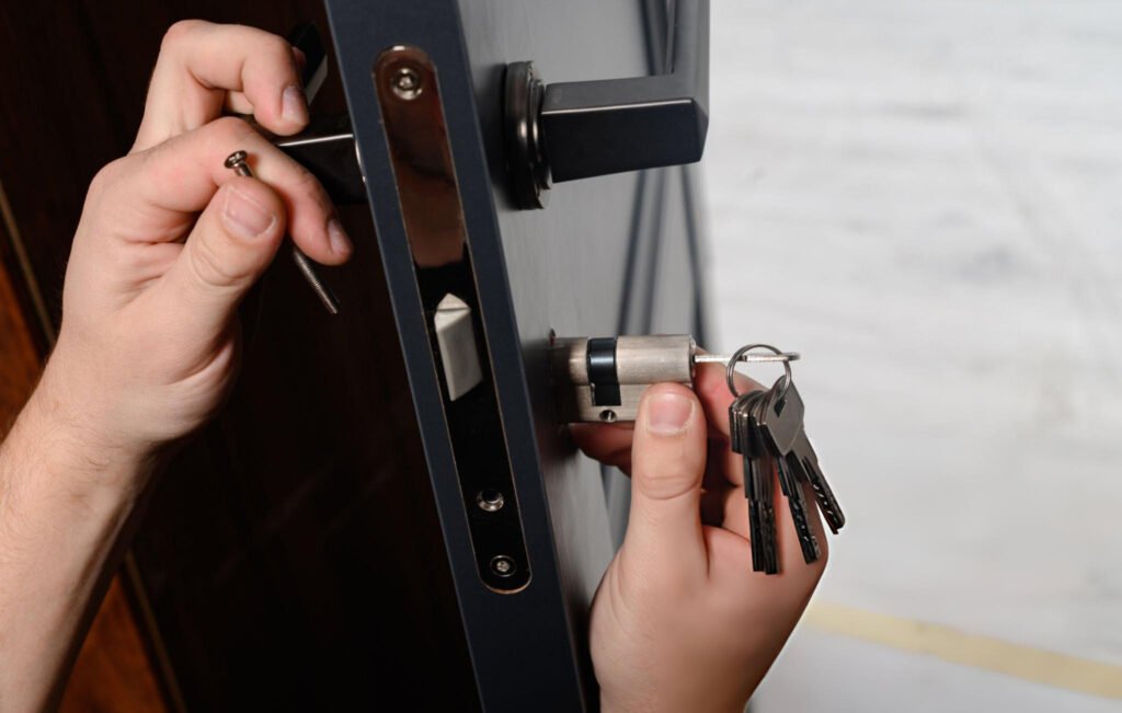 handyman changing door lock